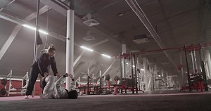 Female wrestlers practicing in gym