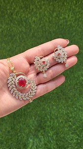Gold Plated American Diamond & Ruby Statement Pendant Set | Sale @ Rs.1250 only | Free Chain Perfect for those who like a classy and sophisticated look. Add a tinge of charm to your attire with these double gold plated pendant set intractely studded with shiny American diamond & Ruby stones. Code - PS-2302018 Old Price - Rs.1500 Sale Price - Rs.1250 only Material - Gold Plated Brass Metal Alloy, Cubic Zirconia & Ruby Stones Included - Pendant, Earrings & Free Chain Simply message us to order. On