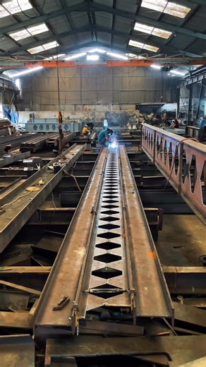 Castellated Beams - Definition and Fabrication Process A castellated beam is a structural steel member derived from a standard rolled I-section by cutting the web along a predetermined zigzag (hexagonal) pattern using thermal or mechanical cutting. The two halves are then longitudinally offset and reconnected by full-penetration welding, resulting in an increased overall depth while maintaining nearly the same cross-sectional area. The cutting pattern typically produces hexagonal web openings, w