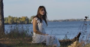 Charming Caucasian Woman Sitting On Lake Stock Footage Video (100% Royalty-free) 1039343756 | Shutterstock