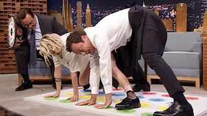 Jimmy and Kristen Stewart face off in a game of Twister where they have to take a Jell-O shot every time they place a body part on a colored spot. | The Tonight Show Starring Jimmy Fallon