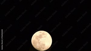 Moon Timelapse, Stock time lapse : Full moon rise in dark nature sky, night time. Full moon disk time lapse with moon light up in night dark black sky. High-quality free video footage or timelapse