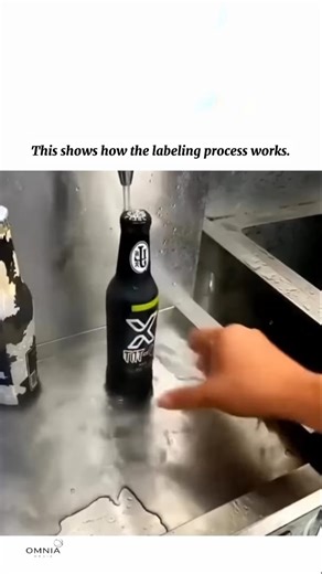 Omnia Media on Instagram: "This illustrates how the labeling process works when warm or hot water is used. In this method, products pass through a labeling station where labels are applied using water-activated adhesive. Warm or hot water is sprayed or brushed onto the adhesive side of the label, activating the glue and making it tacky. Once activated, the label is precisely positioned and pressed onto the product surface. The use of warm or hot water ensures faster adhesive activation and stron