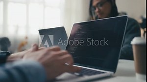 IT specialists working in office, creating computer programs, typing in code