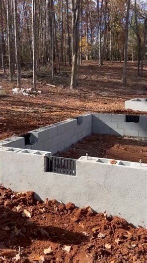 Foundation phase complete on this 2,600 sq. ft. crawl space build in progress! Waterproofing and stucco block finish applied for long-term protection and clean aesthetics. Framing package has arrived, time to go vertical and bring this structure to life. Every great home starts with a solid foundation. #HuskyBuilders #QualityFromTheGroundUp #CustomBuilds #SCConstruction #CrawlSpaceFoundation #bluecollar #construction #builder #newconstruction #constructionlife | Husky Builders