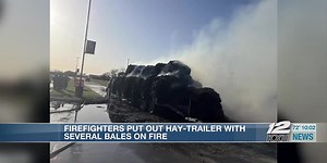 Bales of hay on fire near the S&S High School