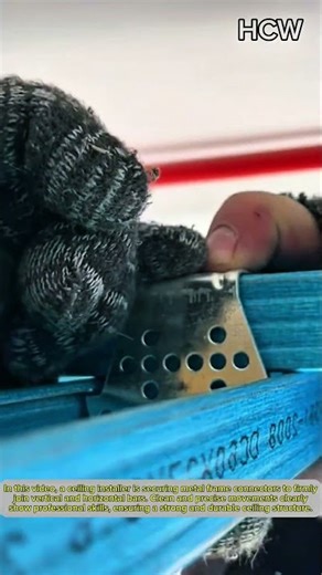 Ceiling Worker Installing Frame Connectors with Perfect Precision.