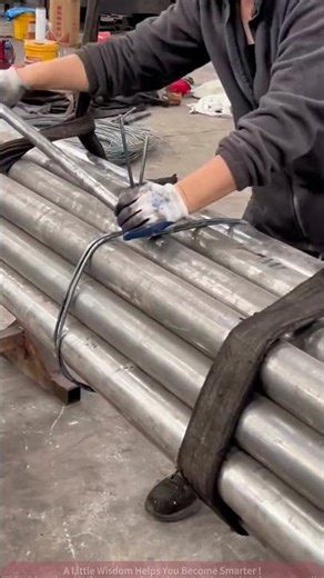 Artisan Secures Steel Pipes with Iron Wire, Steady and Tight!