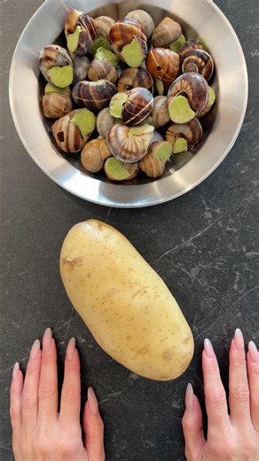 Baked Giant Potato with Snails, Garlic Butter and Herbs