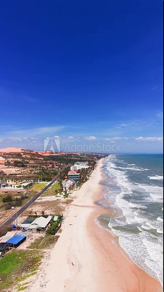 Coastal view of Tan Thanh in Ham Thuan Nam, Binh Thuan, Vietnam, with clear skies and a vibrant beach.