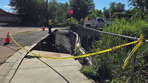 Storm damage in Santa Fe with repairs underway