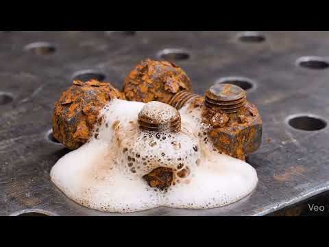 Ultra-realistic macro video of extremely rusted bolts and nuts scattered on a rough metal surface