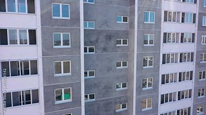 Construction of a multi-storey panel reinforced concrete house. Safe ramp at the entrance to the building. Construction site safety