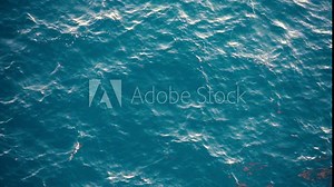 Slow motion over disturbed ocean water surface, loopable. Impressive background for movie credits or intro Stock Video