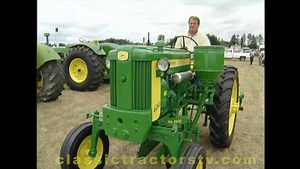 Follow this link, https://youtu.be/BmhAxcyx6Bg to watch the complete video on the Classic Tractor Fever YouTube Channel. In this video from our collection, John McCoy in Washington State has put together a first class collection of classic John Deere Tractors. At the time of this shooting he had 38 tractors, but was dealing on number 39. Of all of John's tractors his favorite is his 1958 John Deere 420V (vegetable) tractor. Only 32 of these tractors were built in 1958. This tractor has a the sla