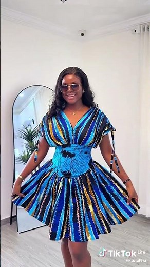 gathered gown with Basque waistline and ruched shoulder