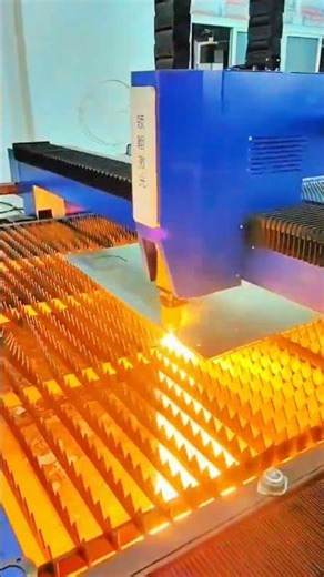 Laser cuts sheet—beam holds rhythm of head, grid, and spark bonds true with crafted precision.