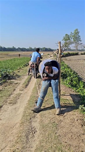 The man inside the drum puts his fake leg outside.574