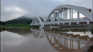 White railway bridge built during World War 2 named Thachomphu Bridge over the Mae Tha river.