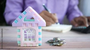 the concept of finance concept , man writing on notepad