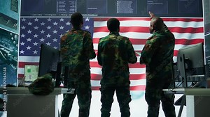 US soldiers in a high tech command center protecting classified information, ensuring cybersecurity and defending against cyber attacks. Army base of operations with trained officers. Camera A.