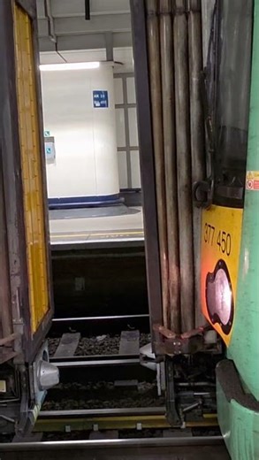 Electrostars 377.201 and 377.450 coupling up at London Victoria.
