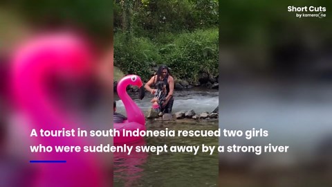Hero tourist rescues two girls swept away by river in Indonesia