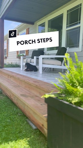 Replying to @TT🖤 THIS AFTER IS… EVERYTHING! 😍😍😍 building these DIY steps for the front of the porch was the best design choice yet. It adds so much warmth and function! I love it up close but from the road it looks like a whole new porch! #diyproject #porch #patiofurniture #patiodecor #curbapeal #diy #womenwithpowertools #easydiy #exteriordesign #frontporch #fixerupper #farmhouse