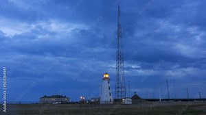 North Cape Lighthouse with windmill turbines Prince Edward Island (PEI) Canada. Renewal energy