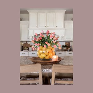 DIY lemon & tulip centerpiece!! 🌷🍋 comment LEMON and I’ll send you links to the vases and flowers! This one is so simple and gives total summer vibes!! I love the combination of tulips and lemons! The pink and yellow complement each other so well!All you do is:Get a bubble vase.Add a smaller vase inside of it.Fill the vase with lemons.Once it’s full, add your flowers in the middle vase and that’s it!! You can use real flowers but I used artificial tulips!I thought this looked so cute in our ki