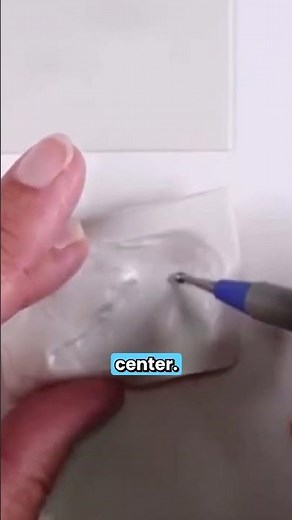 Using tools to create a perfect puffy polymer clay shape, this one's a bird