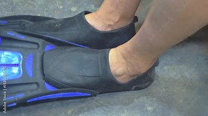 Fin Fitting and Donning. Close up Process of Testing and removing diving or snorkeling fins