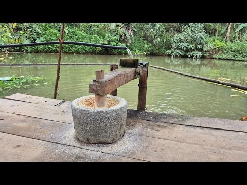 The familiar sound of a water-powered corn mill.