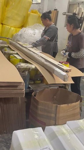 Workers are manually packing and shipping the goods hand pack for delivery manual packing and ship