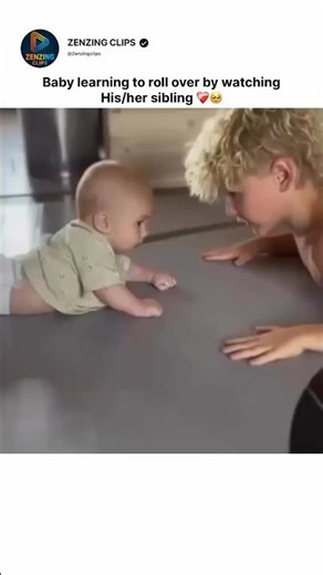 Baby learning to roll over by watching his/her sibling 🥹❤️‍🩹