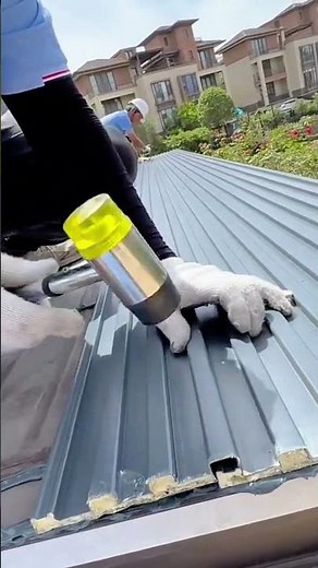 Installing Insulated Metal Roof Panels on Building Rooftop