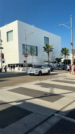 10K views · 109 reactions | A Tesla Model X in a bold rainbow wrap...