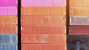 A container terminal, is a key infrastructure facility in the logistics and transportation industry that provides storage, handling, and transfer services for shipping containers. Aerial view Drone.