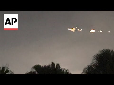 Video captures Boeing 747 plane on fire before making emergency landing