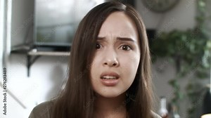 Angry Young Woman Looking Into Camera Making Different Faces