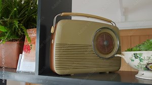 A retro vintage wireless portable radio from the nineteen fifties