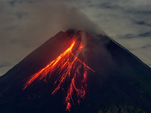 Indonesian rescuers dig through volcanic ash after eruption kills 9