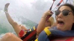 Women Parasailing Scream as Their Feet Hit Shark-Infested Water