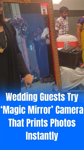 Pune News Age on Instagram: "A new trend is capturing attention this wedding season—the magic mirror camera. A viral video shows what appears to be a normal mirror, but hidden inside is a camera that takes photos and prints them instantly. In the clip, a family of four poses in front of the mirror while someone taps on it to trigger the camera. Within seconds, the mirror captures the moment and a printer beside it produces a hard copy of the photo. The quick, seamless process has amazed social m