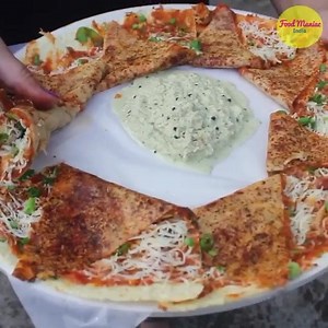 This video is sure to get you salivating by the end of it. This Pizza Dosa loaded with cheese is a college student favourite! Where: Anand Stall, Opposite Mithibai College, Ville Parle, Mumbai. Video Credit: @foodmaniacindia | TGF - The Guiding Factor
