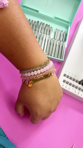 Make a custom bracelet with the Jewelry Press! Designer Ivy Pe @ivyPINK shares her creative process in our latest video. Shop supplies at the link below. SUPPLIES & TOOLS: Jewelry Press: https://americancrafts.com/collections/jewelry-making/products/we-r-makers-jewelry-press-kit Jewelry Press Name Bar Charm Other Supplies: Stretch String Beads DIRECTIONS: -Use the Jewelry Press on a hard flat surface to make your print using the stainless steel bar charm. -Make sure to set the dial on 10 and pre