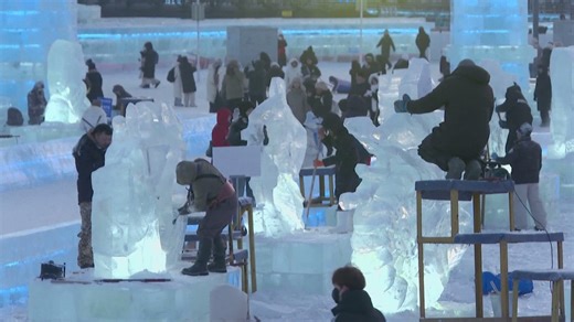 Artists carve ice sculptures for festival