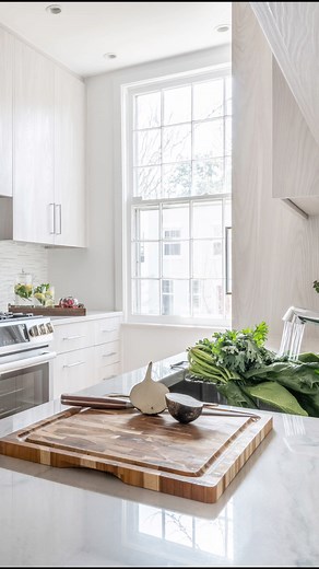 Small space, big transformation 🌿 This reimagined city row house kitchen blends warmth and functionality with light-toned materials, textured laminate cabinetry, and subtle green mosaics. Thoughtful layout changes and hidden storage make the compact space feel open, calm, and inviting. Designed by #JGKB Photography by Keiana Photography | Jennifer Gilmer Kitchen & Bath