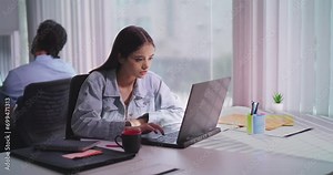 Indian Hindu gen z young adult woman lady sitting desk chair use laptop look screen work online check email task indoor office Hindu India teen female girl read good news feel great get new job deal