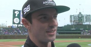 Indy 500 champ throws first pitch at Cubs game